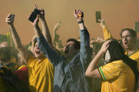 Fans in Sydney cheer after Australia scores a goal in the World Cup round of 16 soccer match between Argentina and Australia on Sunday, Dec. 4, 2022. (AP Photo/Rick Rycroft)