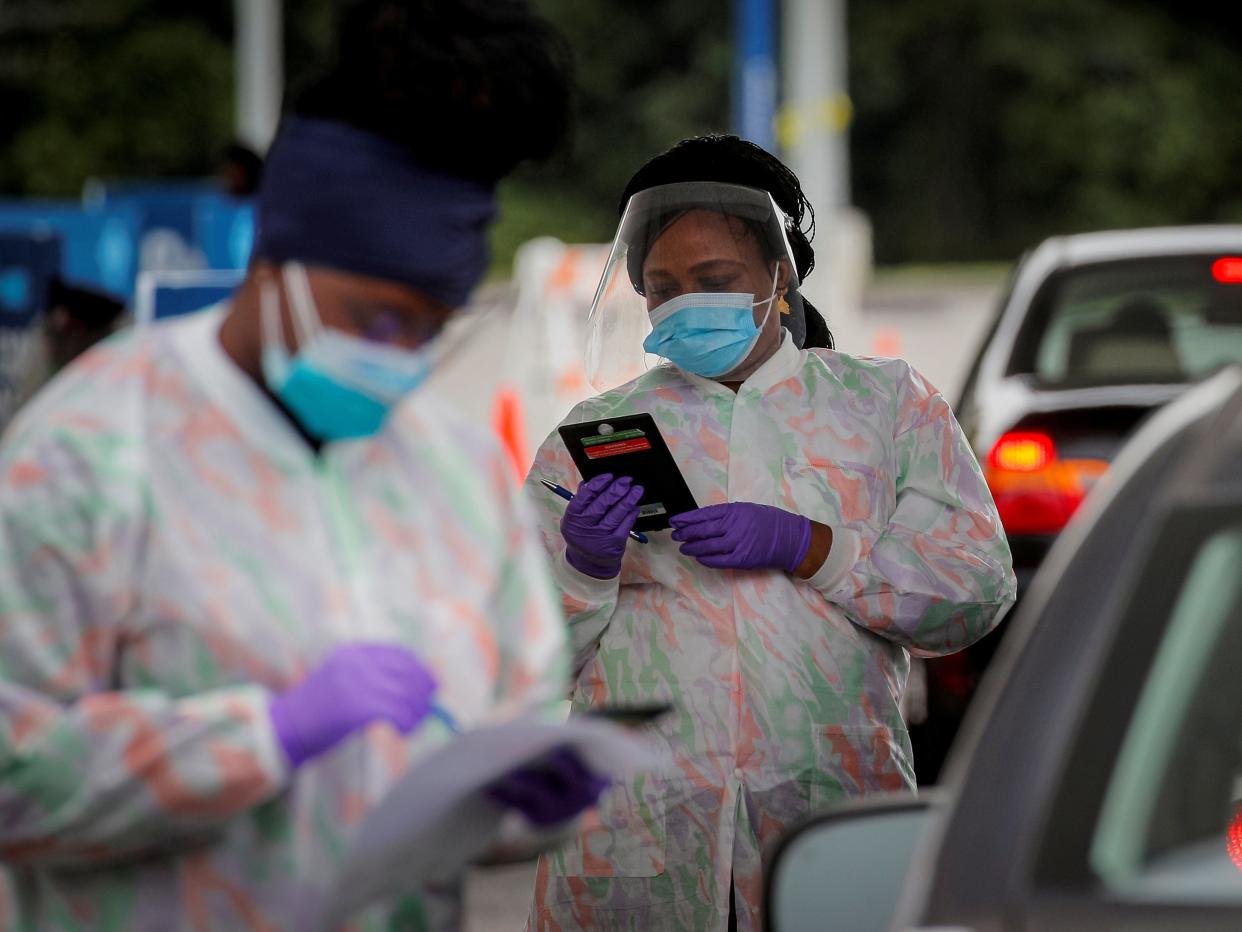 coronavirus testing technicians workers cars drive thru