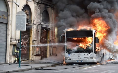 This bus exploded on the street, 200 yards from the Trevi Fountain in central Rome, in May this year - Credit:  Morandi/Tre/IPA/REX/Shutterstock