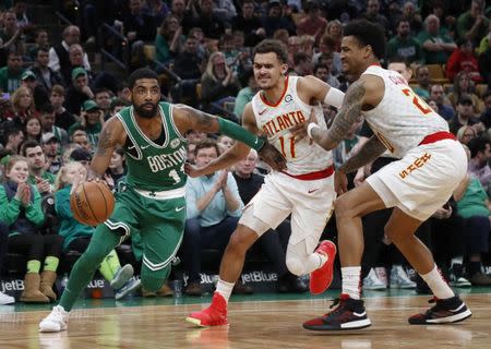 Mar 16, 2019; Boston, MA, USA; Boston Celtics guard Kyrie Irving (11) drives past Atlanta Hawks guard Trae Young (11) during the second half at TD Garden. Mandatory Credit: Winslow Townson-USA TODAY Sports