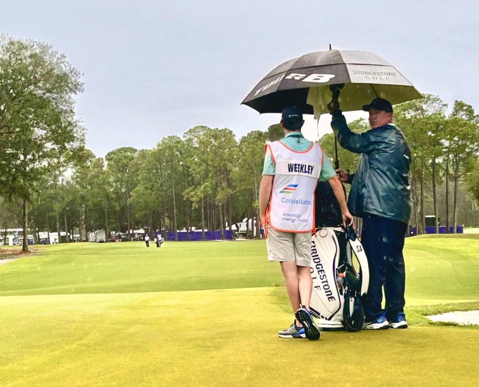 Boo Weekley waits with his caddie by the ninth green of the Timuquana Country Club on Sunday for the re-start of the final round. Play in the Constellation Furyk & Friends PGA Tour Champions event was suspended briefly to clear water from some of the greens.