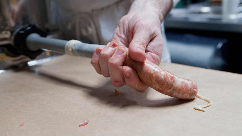 man making sausage