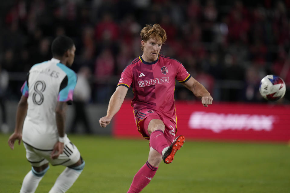 St. Louis City's Tim Parker, right, passes around Minnesota United's Joseph Rosales (8) during the second half of an MLS soccer match Saturday, April 1, 2023, in St. Louis. (AP Photo/Jeff Roberson)