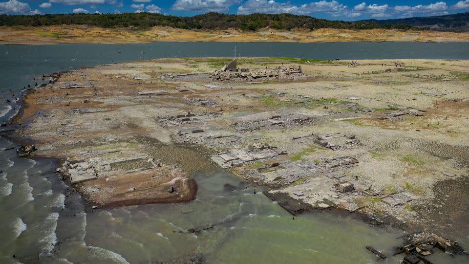 Water still surrounds the dried up part of the dam. A lack of rain has pushed the water levels down. - Ezra Acayan/Getty Images