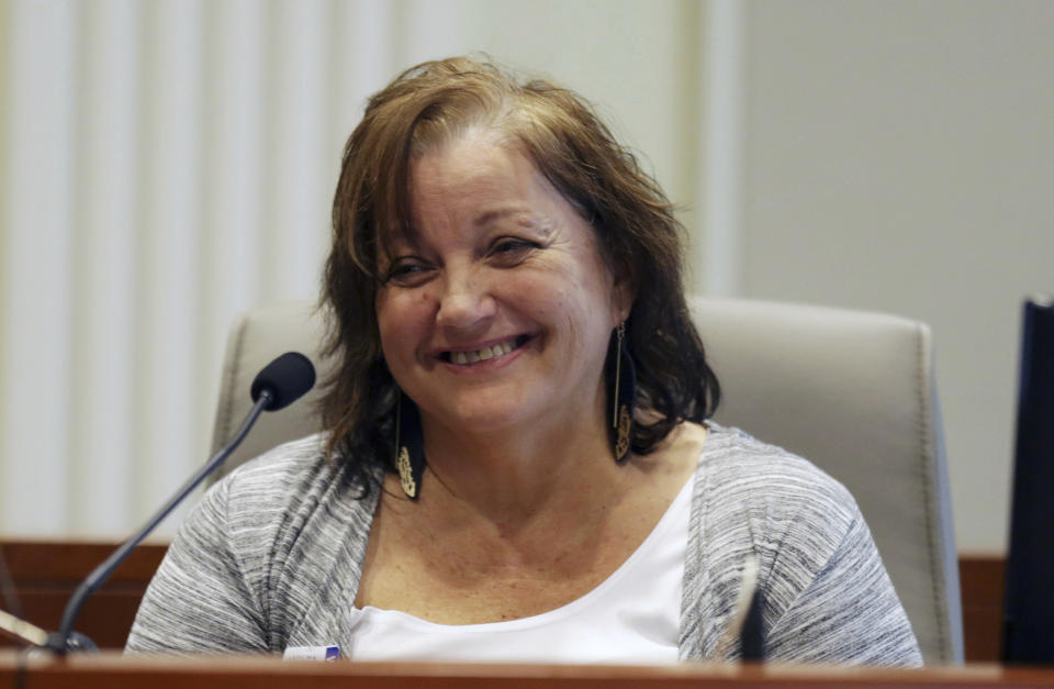 Sandra Dowless laughs under cross-examination during the public evidentiary hearing on the 9th Congressional District investigation at the North Carolina State Bar Monday, Feb. 18, 2019, in Raleigh. Dowless was surprised by evidence that McCrae Dowless was paid nearly $84,000 in consulting fees over five months leading into last year's general election. (Juli Leonard/The News & Observer via AP, Pool)