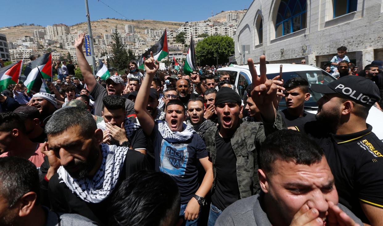 Palestinian protesters shout slogans against Israel during a rally to support Gaza in the West Bank City of Nablus (EPA)