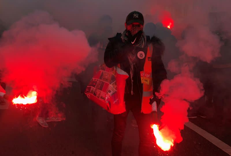 French SNCF railway workers on strike attend a demonstration in Paris