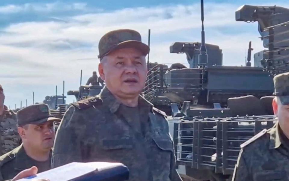 Sergei Shoigu inspects military vehicles to be sent to Russia yesterday - Shutterstock