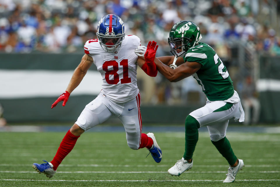 New York Giants wide receiver Alex Bachman (81) runs against New York Jets cornerback Isaiah Dunn (27) in the second half of a preseason NFL football game, Sunday, Aug. 28, 2022, in East Rutherford, N.J. (AP Photo/John Munson)