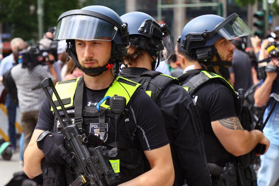 A police tactical team secures the area, near a car that crashed into a group of people before hitting a storefront at Tauentzienstrasse (REUTERS)