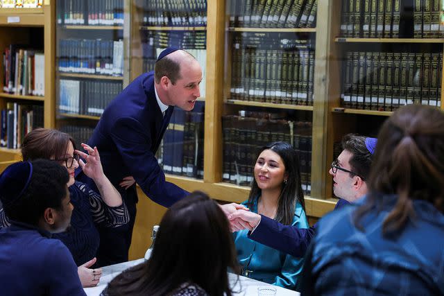 <p>TOBY MELVILLE/POOL/AFP via Getty Images</p> Prince William meets with young people at the Western Marble Arch Synagogue in London, on February 29.