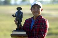 Apr 21, 2019; Hilton Head, SC, USA; C.T. Pan poses with the RBC Heritage trophy after winning the 51st RBC Heritage golf tournament at Harbour Town Golf Links. Mandatory Credit: Joshua S. Kelly-USA TODAY Sports