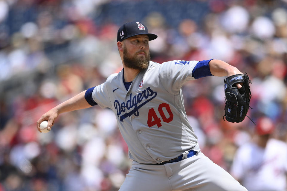 FILE - Los Angeles Dodgers starting pitcher Jimmy Nelson delivers a pitch during a baseball game against the Washington Nationals on July 4, 2021, in Washington. Nelson finalized a $1.2 million contract on Thursday, Feb. 16, 2023, with the Los Angeles Dodgers. (AP Photo/Nick Wass, File)
