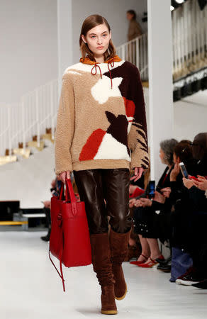 A model presents a creation from the Tod's Autumn/Winter 2018 women collection during Milan Fashion Week in Milan, Italy February 23, 2018. REUTERS/Alessandro Garofalo