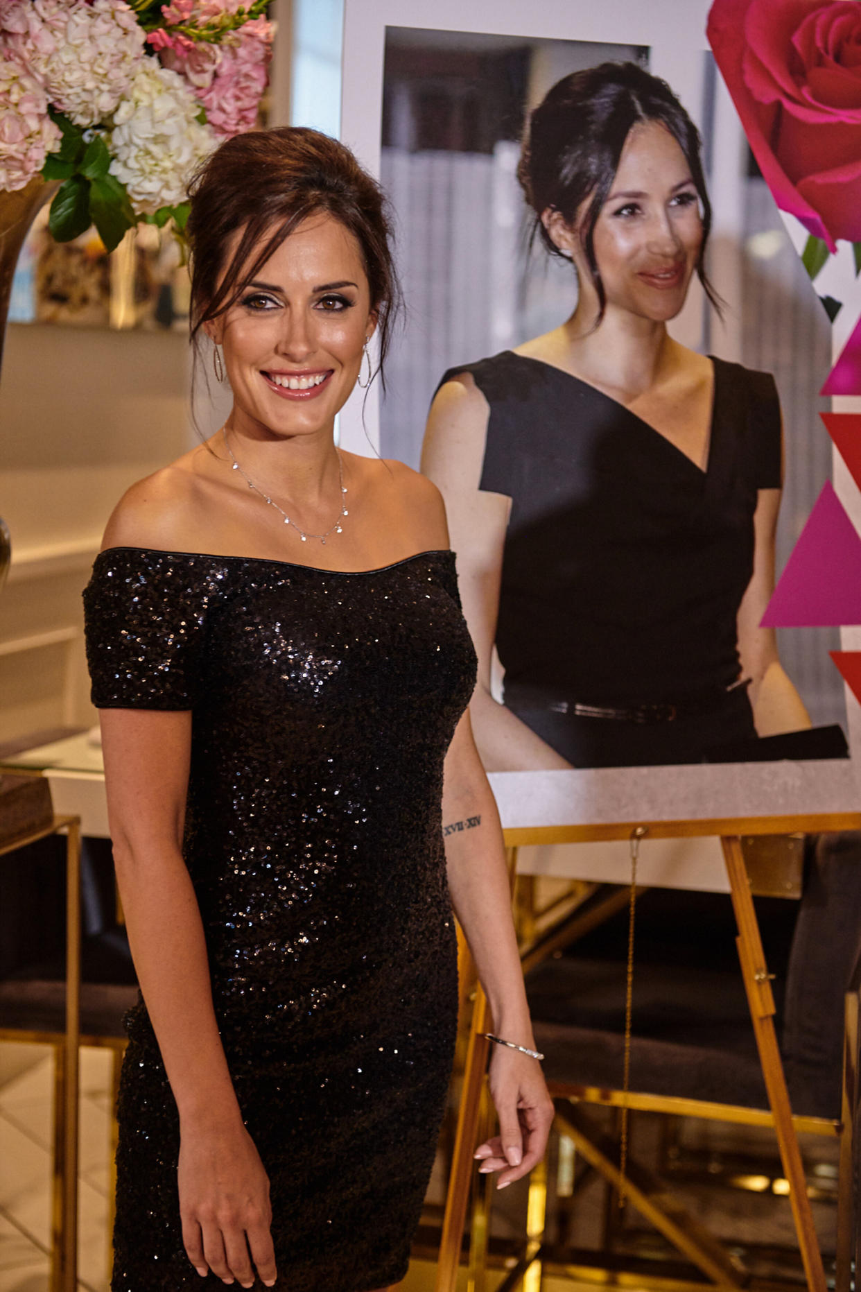 Tanya at her unveiling event revealing her likeness to Meghan Markle. Photo: Caters News