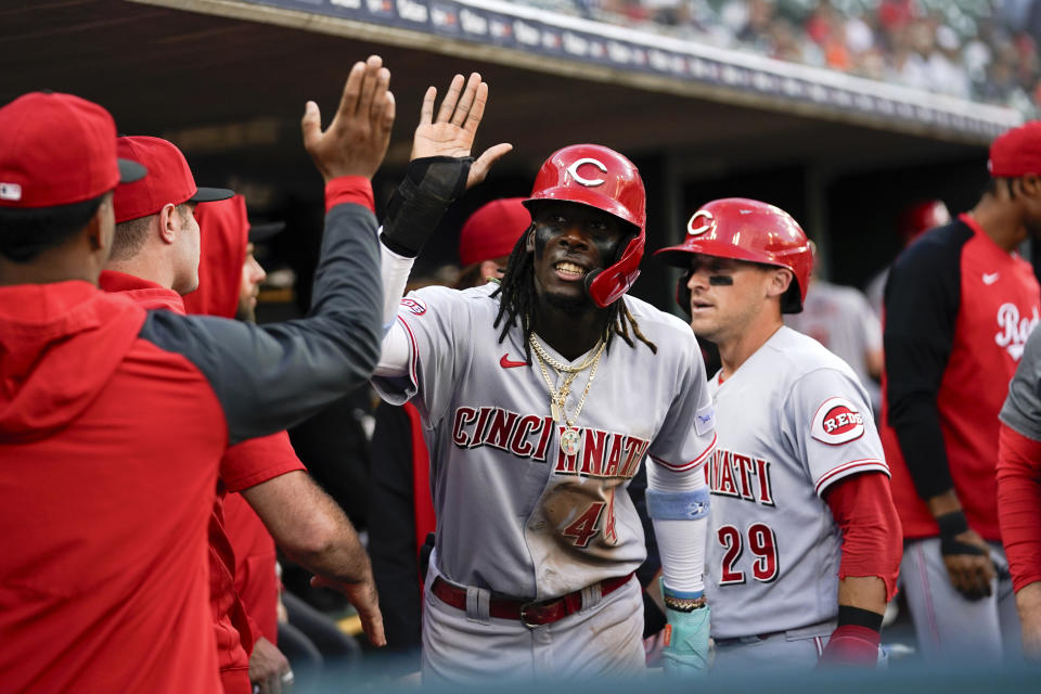 Cincinnati Reds' Elly De La Cruz (44) and TJ Friedl (29) celebrate scoring against the Detroit Tigers in the second inning of a baseball game, Tuesday, Sept. 12, 2023, in Detroit. (AP Photo/Paul Sancya)