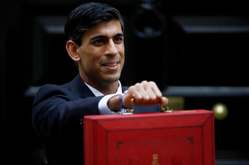 Britain's Chancellor of the Exchequer Rishi Sunak poses outside his office in Downing Street in London