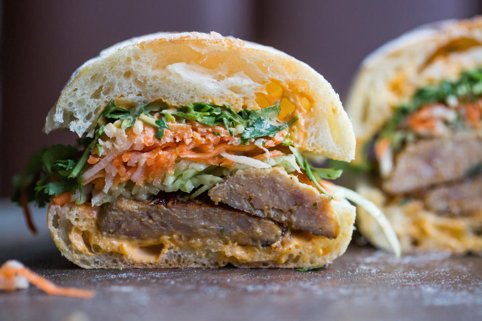 This banh mi is served on ciabatta with enormous pork meatballs, Sriracha mayo and the usual assortment of pickled veggies, cilantro and cucumber. (Photo: Alan Weiner photography)