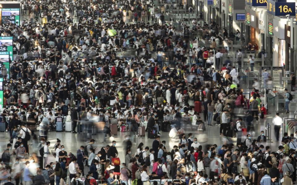 Passengers wait in Hongqiao High-speed Railway Station in Shanghai - Qilai Shen/Bloomberg