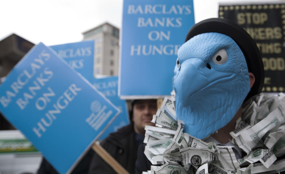 Demonstrators protesting about Barclays Bank and its world wide operations outside the Royal Festival Hall where the Barclays Bank Annual General Meeting for shareholders is being held in London, Friday, April 27, 2012. Barclays PLC reported a 25 percent gain in first-quarter net profit on Thursday, beating market forecasts with strong performances in its retail and business banking, and wealth and investment management divisions. For the three months ending March 31, Barclays reported an adjusted profit after tax of 1.87 billion pounds ($3 billion) after taxes, compared to 1.5 billion pounds a year earlier. Income rose by 5 percent to 8.14 billion pounds.(AP Photo/Alastair Grant)