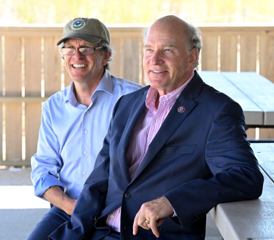 EPA regional administrator David W. Cash (left) and U.S. Representative Bill Keating (D-Mass.) listen to town manager Mark Ells before the announcement of the 2022 Beach Act Funding for Massachusetts at Kalmus Beach in Hyannis in August 2022.