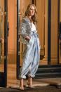 <p>Celine does Balmain in baggy denim jeans, a silver sequined blazer, and matching pumps for a night out. </p>