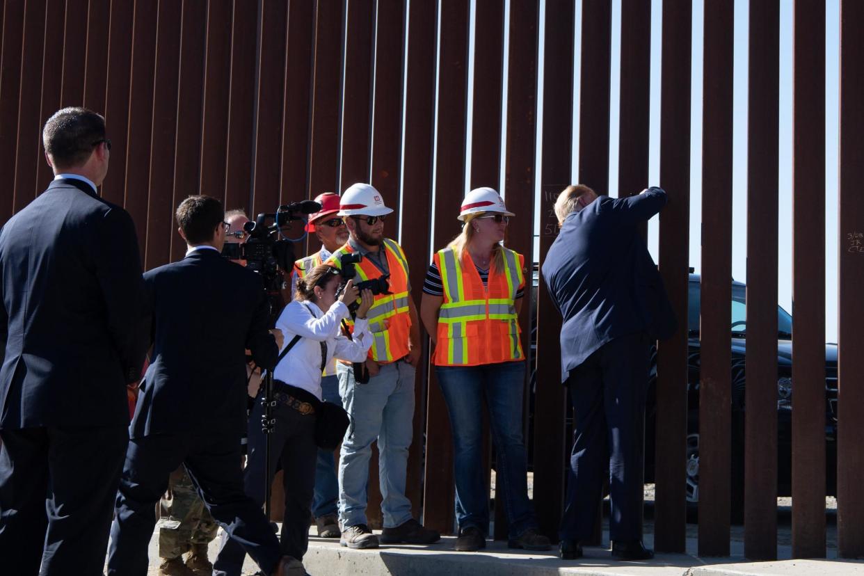 President Donald Trump signs the US-Mexico border fence during a visit to Otay Mesa California on September 18 2019. (NICHOLAS KAMM/AFP)