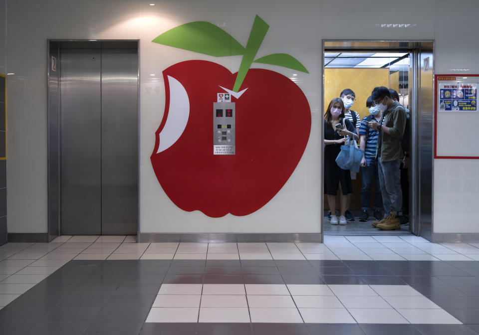 A huge logo of Apple Daily is displayed at the lift lobby outside the news room of Apple Daily Monday, April 26, 2021. A year ago, the pro-democracy Apple Daily newspaper published a front-page headline saying Hong Kong's governing principle of “one country, two systems is dead." On Thursday, June 17, 2021, the newspaper was facing its greatest peril. Three top editors and two senior executives were arrested under Hong Kong's new national security law. (AP Photo/Vincent Yu)