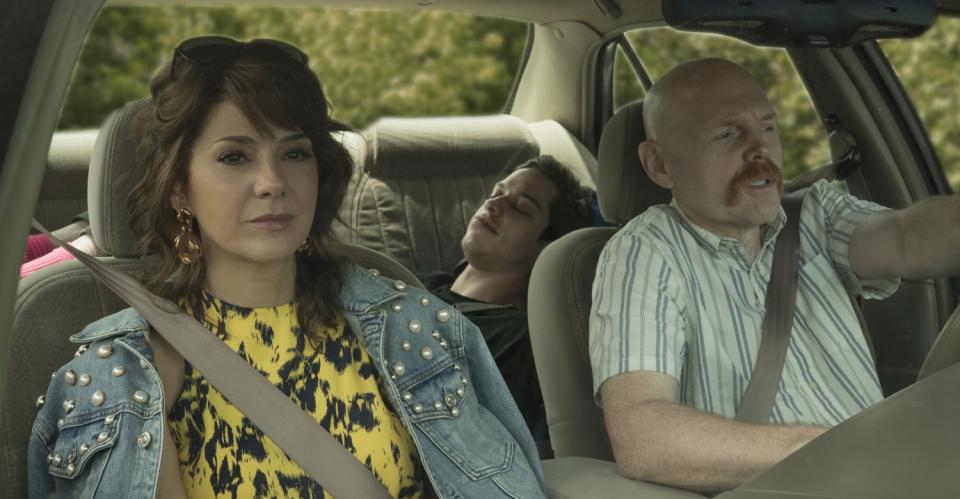 Marisa Tomei, Pete Davidson, in back, and Bill Burr in a scene from "The King of Staten Island."