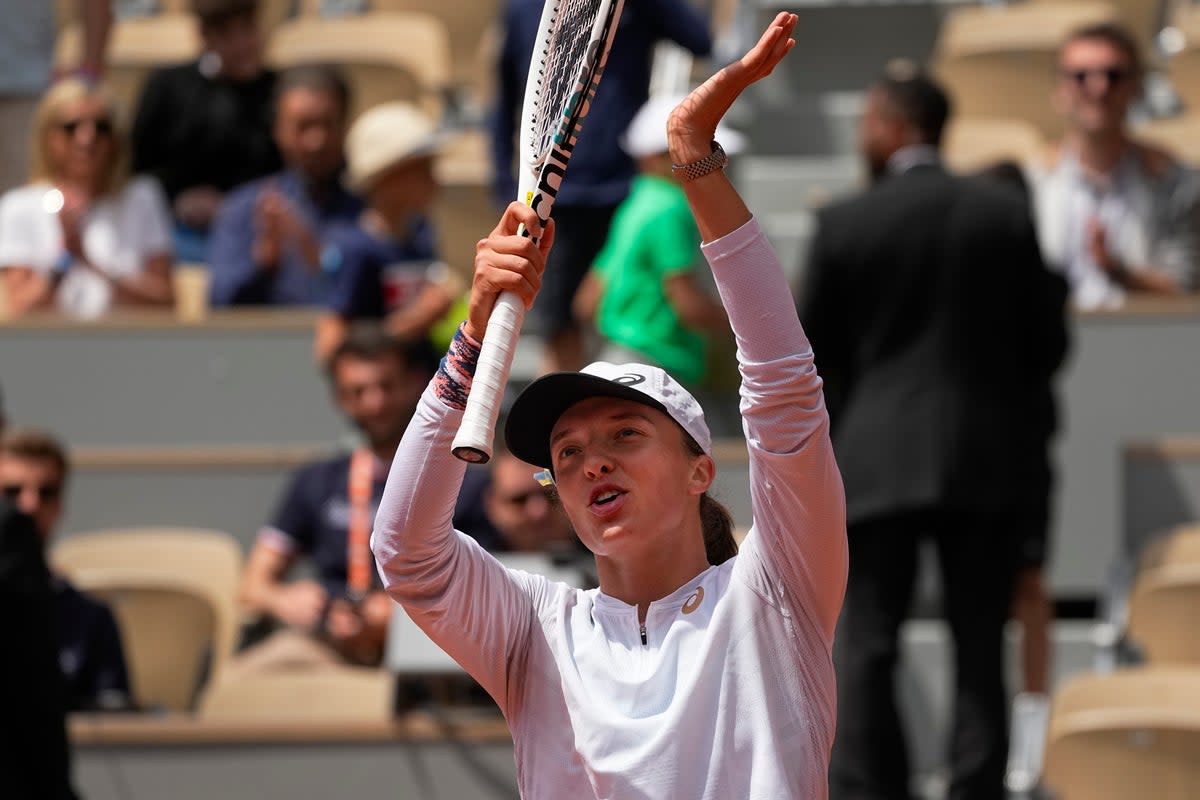 Iga Swiatek celebrates winning her match against Danka Kovinic (Michel Euler/AP) (AP)