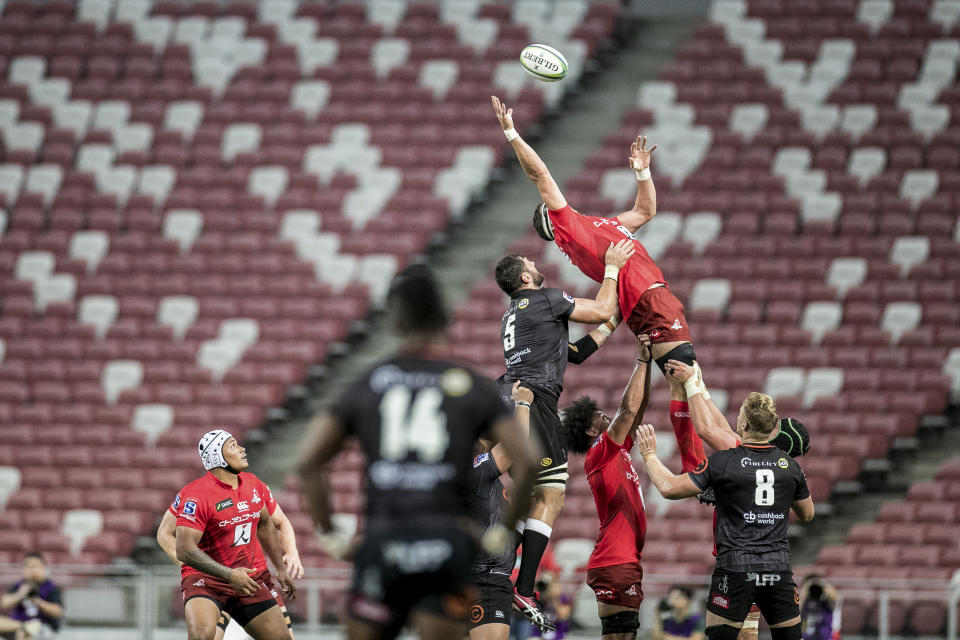 Luke Thompson of the Sunwolves catches a line up throw during the Super Rugby match between the Sunwolves and the Sharks at Singapore National Stadium, in Singapore, Saturday, Feb. 16, 2019. (AP Photo/Danial Hakim)