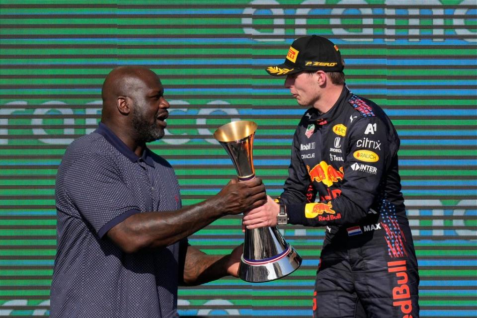 Shaquille O’Neal, left, hands the winner’s trophy to Red Bull driver Max Verstappen (Nick Didlick/AP) (AP)