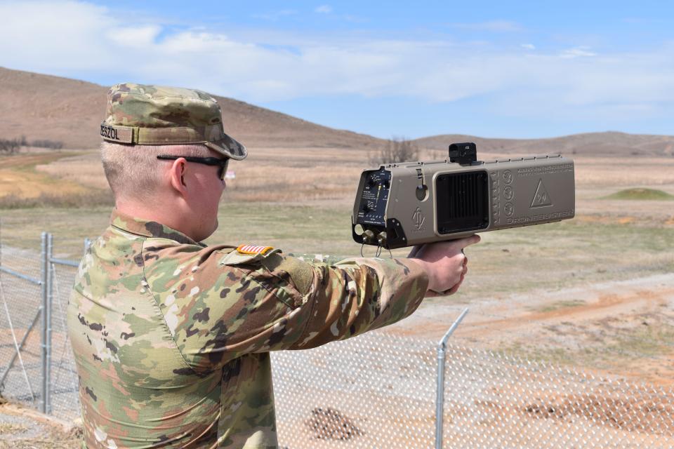 A Wisconsin National Guardsman holds up a Drone Buster.