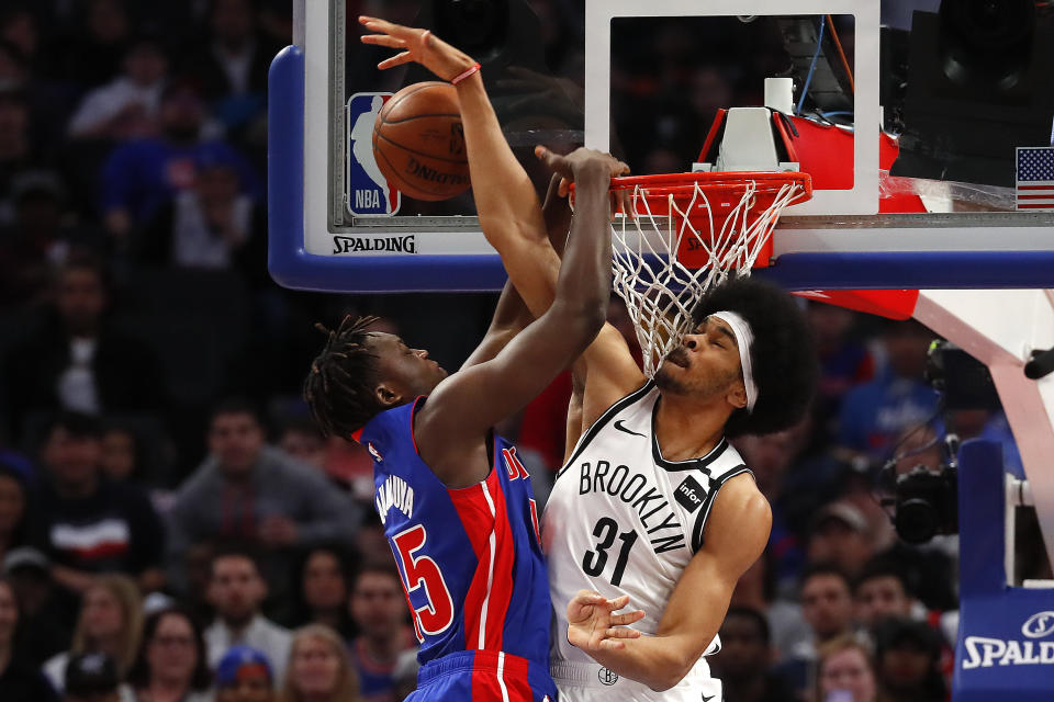 Brooklyn Nets center Jarrett Allen (31) blocks a Detroit Pistons forward Sekou Doumbouya (45) dunk-attempt in the first half of an NBA basketball game in Detroit, Saturday, Jan. 25, 2020. (AP Photo/Paul Sancya)