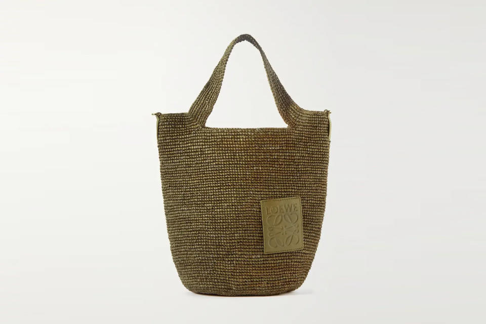 
Loewe
+ Paula's Ibiza Slit leather-trimmed woven raffia tote
USD$1,300 