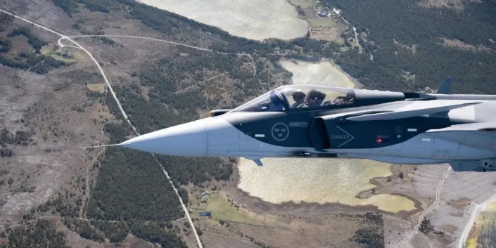 A Swedish airforce Jas 39 Gripen E jet fighter flies over Gotland island in the baltic sea on May 11, 2022.