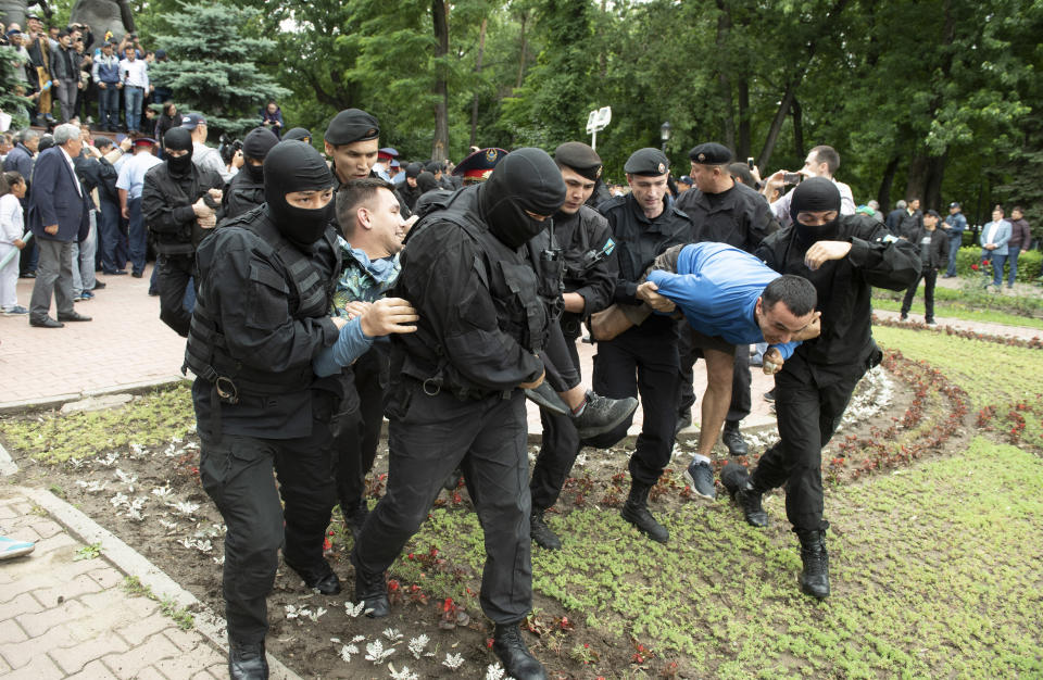 Kazakh police detain demonstrators during an anti-government protest during the presidential elections in Almaty, Kazakhstan, Sunday, June 9, 2019. Voters in Kazakhstan are choosing a successor to the president who had led the Central Asian country since independence from the Soviet Union, with a longtime loyalist expected to win easily. (AP Photo)