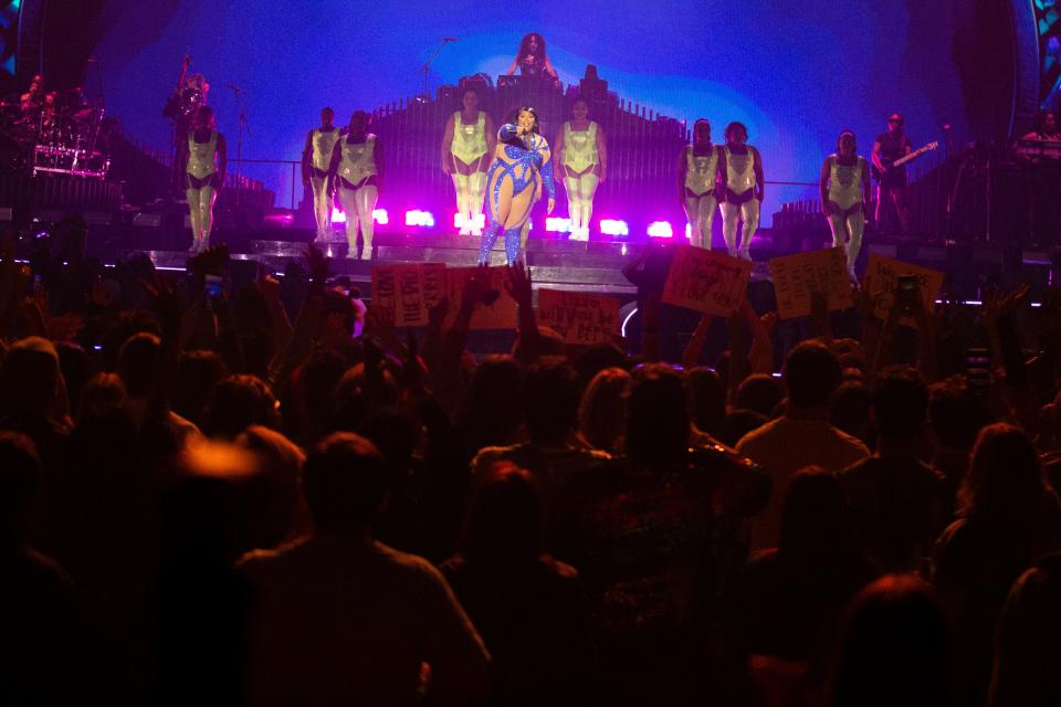 Lizzo points to a fan with a sign while performing during her ‘The Special 2our’ show at FedExForum in Memphis, Tenn., on Monday, April 24, 2023. 