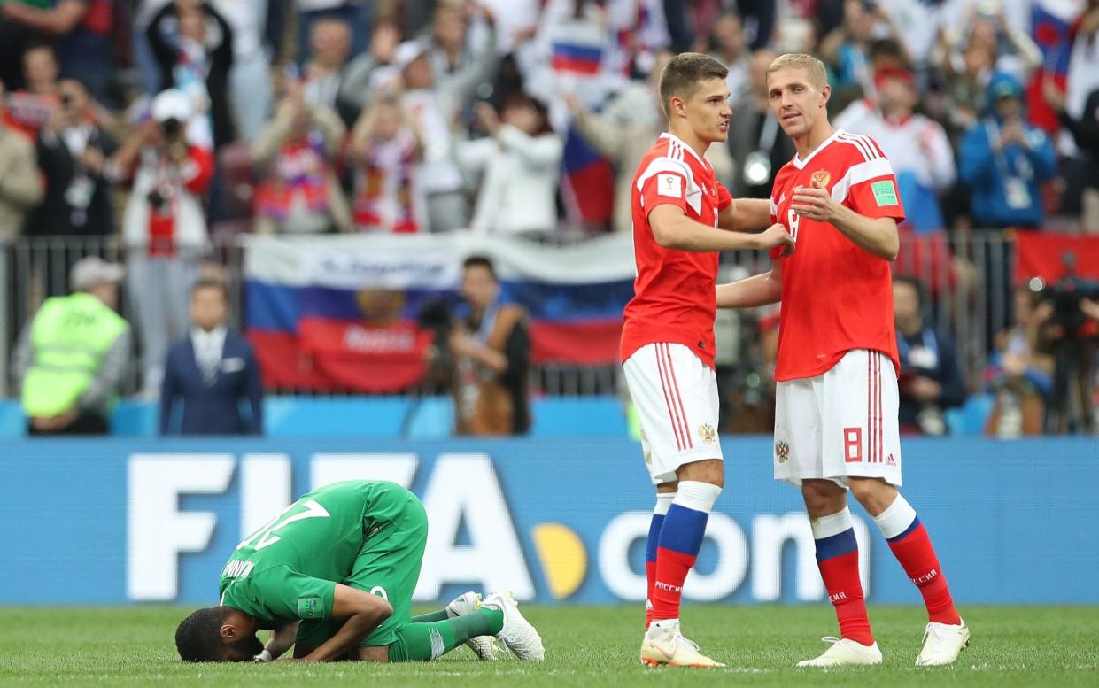 Muhannad Asiri, the Saudi Arabia goalkeeper, at full-time as Russia celebrate a perfect start as hosts of the tournament - Getty Images Europe