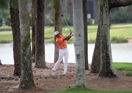 Feb 26, 2017; Palm Beach Gardens, FL, USA; Rickie Fowler hits his second shot on the ninth hole during the final round of The Honda Classic at PGA National (Champion). Mandatory Credit: Jason Getz-USA TODAY Sports