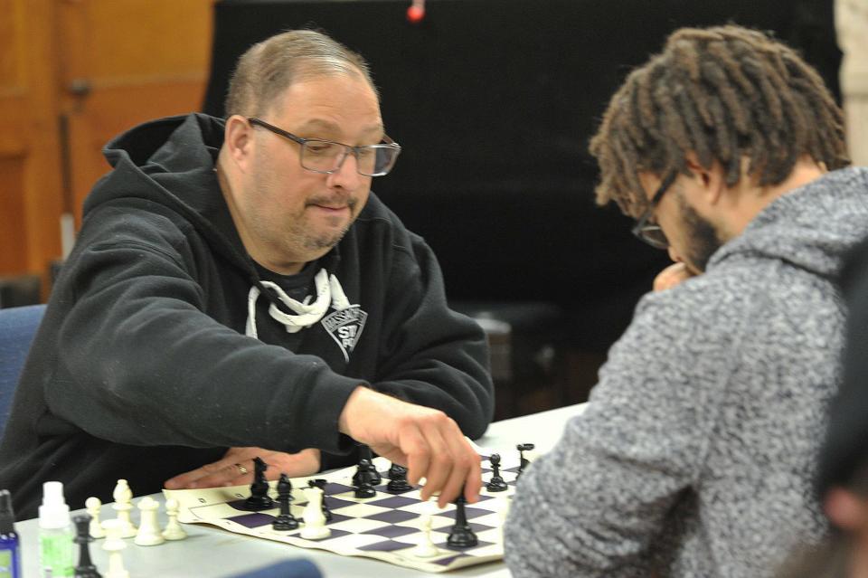 Mark DeVico, of Dorchester, left, makes a move as challenger Elvin Monteiro, also of Dorchester, watches during the first night of the Quincy Chess Club at Bethany Congregational Church in Quincy on Wednesday, Jan. 3, 2024.