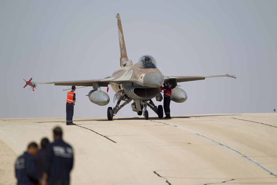 FILE - In this Nov. 25, 2013 file photo, Israeli air force technicians check an Israeli air force plane F-16 of the Red Dragon squadron at Ovda airbase near Eilat, southern Israel. Croatia's defense minister says Israel has failed to overcome U.S. objections to a plan to sell 12 used fighter jets to Croatia and the $500 million deal will likely be canceled. Damir Krsticevic spoke after a meeting with Israeli defense officials in Zagreb on Thursday, Jan. 10, 2019. (AP Photo/Ariel Schalit, file)