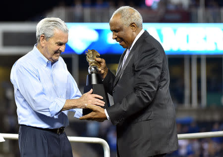 FILE PHOTO: Oct 23, 2015; Kansas City, MO, USA; Frank Robinson presents Kansas City Royals owner David Glass with the American League championship trophy after defeating the Toronto Blue Jays in game six of the ALCS at Kauffman Stadium. Mandatory Credit: Peter G. Aiken-USA TODAY Sports / Reuters Picture Supplied by Action Images/File Photo