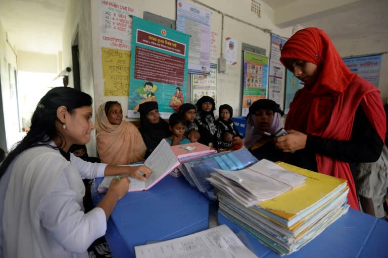 Rohingya Muslim refugees are seen by medical personnel inside a government-run family planning centre in the Bangladeshi town of Palongkhali