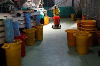 A worker moves a trolly with processed tea at the Kambaa Tea Factory in Githunguri