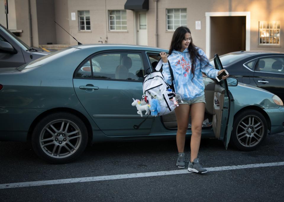 Sky Bloomer, 18, jumps out of a friend's car as they head to Montgomery Blair High School in Silver Spring, Md., on September 25, 2019.