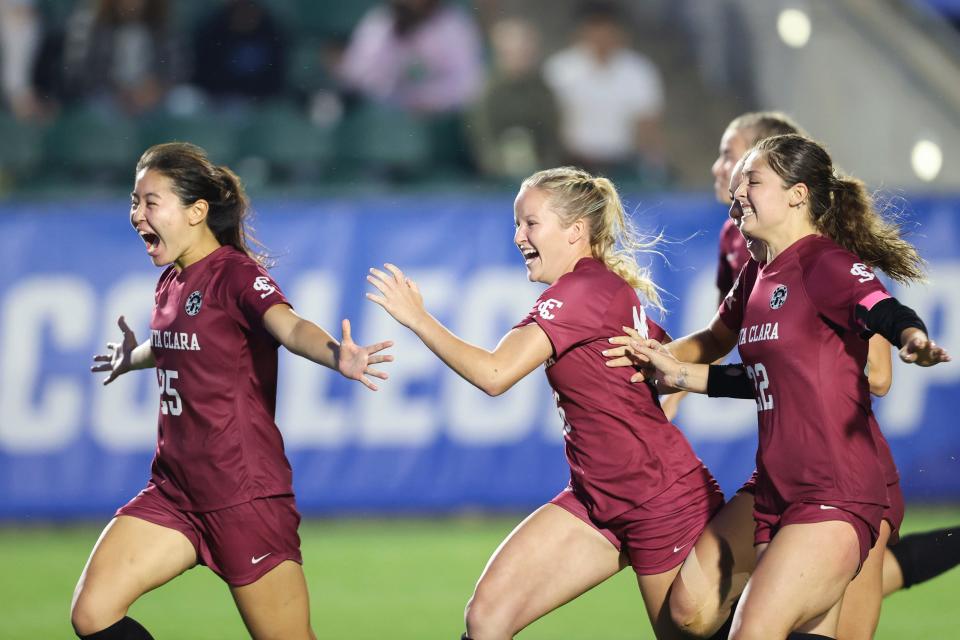 Santa Clara players react as they win against Florida State in the Women's College Cup Championship.