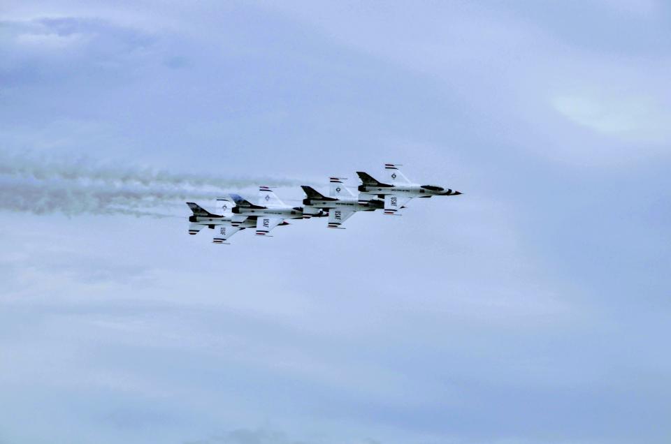 U.S. Air Force Thunderbirds F-16 Flying Falcons fly excruciatingly close to each other during the Air Force Academy graduation airshow, May 26, 2021.