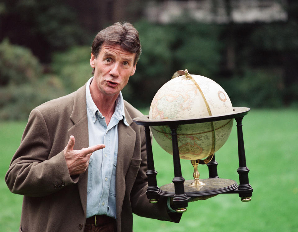 Writer and actor Michael Palin with a globe, 8th October 1992. (Photo by Mike Maloney/Mirrorpix/Getty Images)