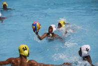 Youth team players warm-up ahead of the Black star water polo competition held at the University of Ghana in Accra, Saturday, Jan. 14, 2023. Former water polo pro Asante Prince is training young players in the sport in his father's homeland of Ghana, where swimming pools are rare and the ocean is seen as dangerous. (AP Photo/Misper Apawu)